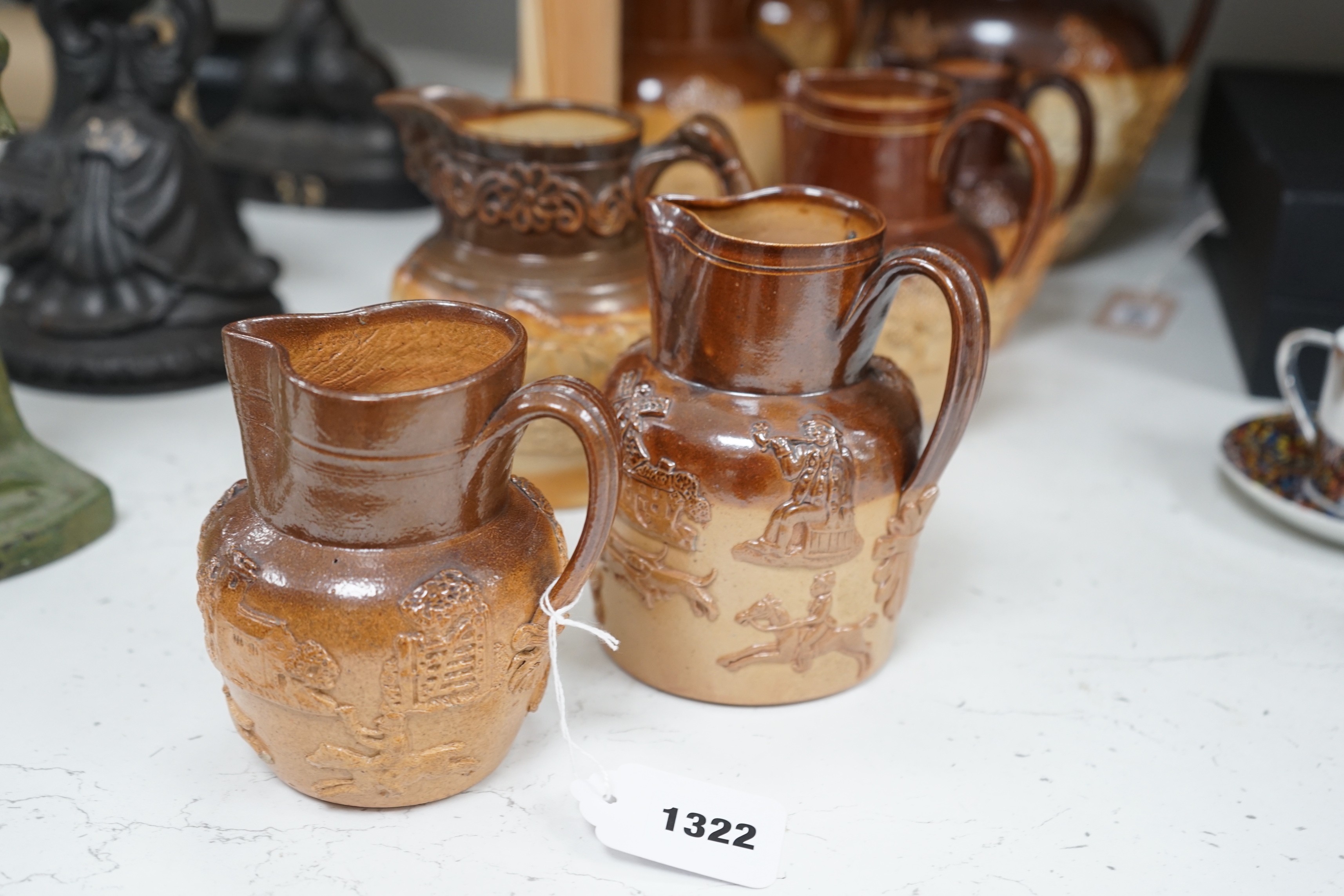 A group of eight Fulham & Lambeth salt-glazed stoneware jugs, tallest 22cm